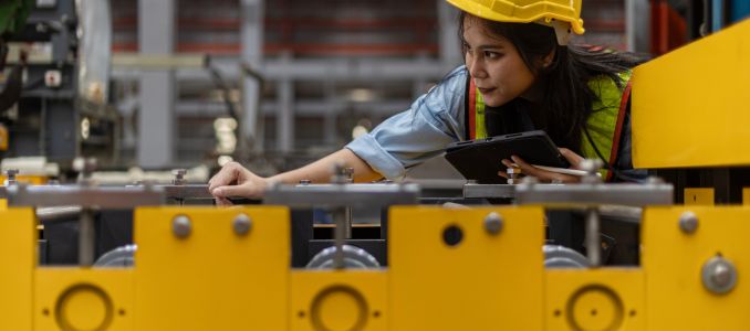 Female Safety Worker Inspects Equipment 