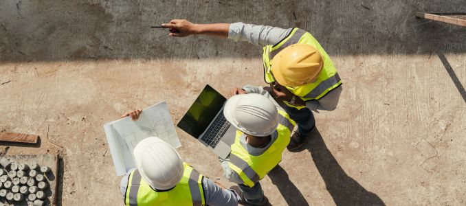 Construction Workers Using a Tablet for Instructions