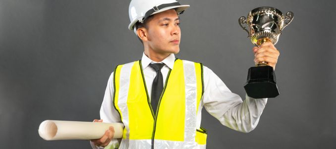 Construction Worker with Award Trophy