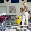 This adjustable mop handle features a double bend, padded grips, and a swivel top, reducing wrist strain and calluses, according to the manufacturer. (Kaivac Inc. photo)