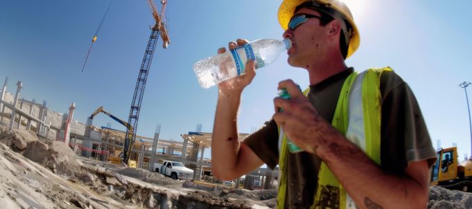Crane Worker Drinking Water Due to Heat