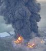 This photo was taken while the fires at the Buncefield fuel storage depot in England were still raging. 