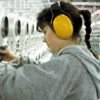 Image of a woman wearing ear muffs.