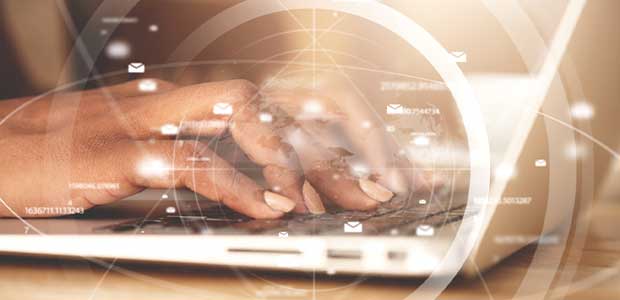 picture of a person typing on the computer, up close of fingers with white circles around computer and icons of envelopes