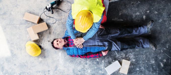 Worker Applying CPR on Job Site